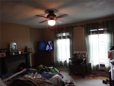 second floor bedroom #2 with decorative fireplace.