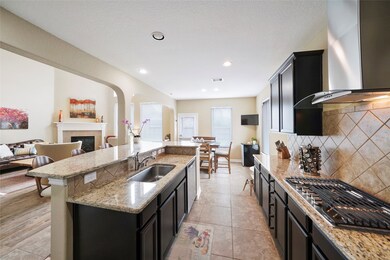 The gourmet kitchen has multi-tiered granite countertops with an undermount sink, stainless steel appliances including a gas stove, oven, dishwasher & microwave.  Plenty of cabinet space for all of your kitchen needs.