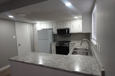 Kitchen with appliances with stainless steel finis