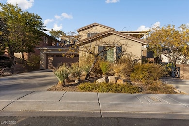 View of front of house featuring driveway, stucco