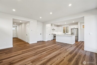 Open concept kitchen, great room and dining room-photo is of a similar plan-finishes, features and inclusions can vary.
