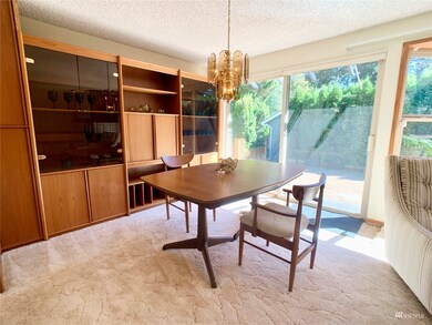 Dining room with Slider to back yard.  Harwood floors under carpet.