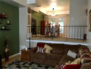 VIEW OF OPEN DINING ROOM ON MAIN LEVEL FROM LOWER 