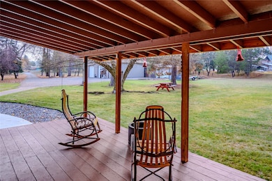 Wooden deck featuring a lawn