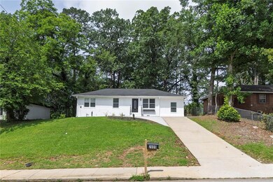 Ranch-style home with concrete driveway