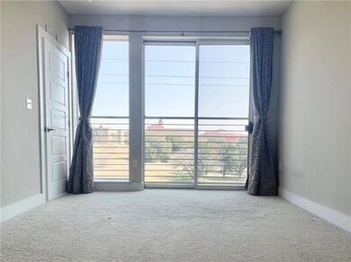 Carpeted spare room featuring plenty of natural l