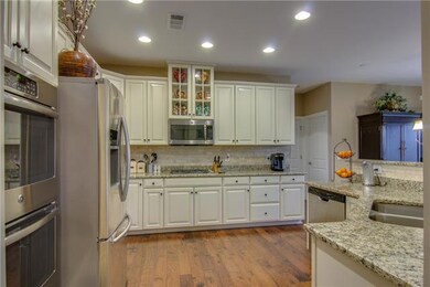 Calling for a fabulous kitchen?  How about double ovens, granite, tile backsplash and gas range?