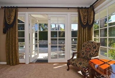 The living room boasts multiple sitting areas.
