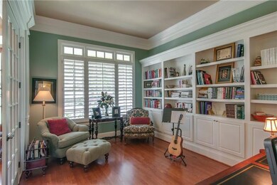 French doors give you access to and tranquility in the library located just off the foyer.  The built-in bookcases are 18 feet long!  And the ceiling height in the foyer, library and formal dining room is eleven feet tall.