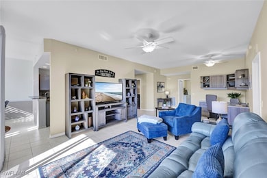 Living area featuring light tile patterned floors,