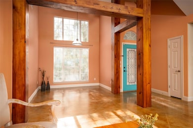 Unfurnished dining area featuring a towering ceil
