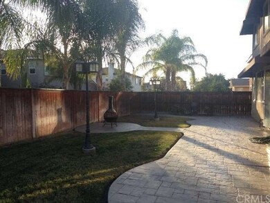 Hardscaped backyard with stamped concrete * 2 ligh