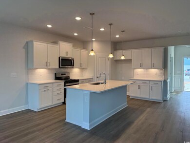 Kitchen with sink, appliances with stainless steel