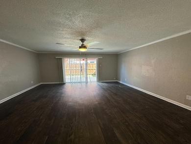 Fenced backyard featuring a patio area and a fire pit