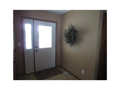 Entryway. Warm and inviting entryway with tile flo
