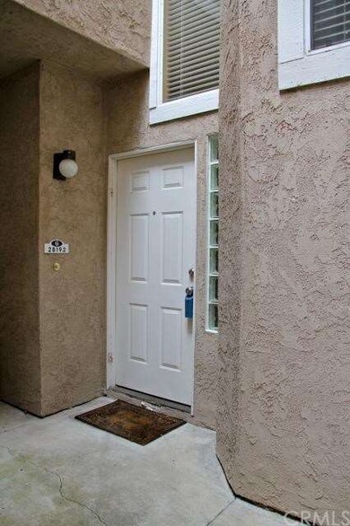 Sidelights at the entry bring natural light into t
