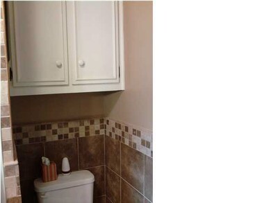 MORE CUSTOM TILE WORK AND PLENTY OF CABINET SPACE
