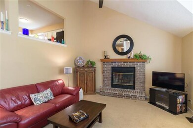 Warm and welcoming great room open kitchen above.