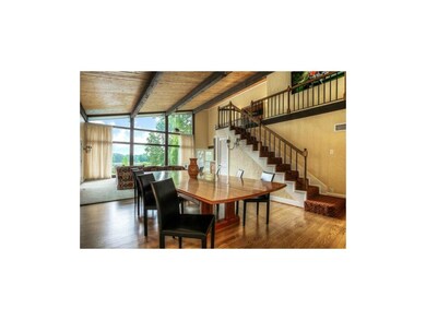 The great room opens to another sitting room, as w