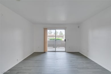 Unfurnished room featuring wood finished floors an