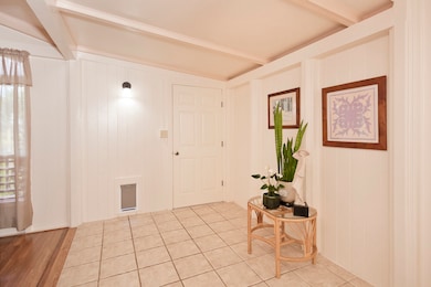 Large tiled entry with new pet door