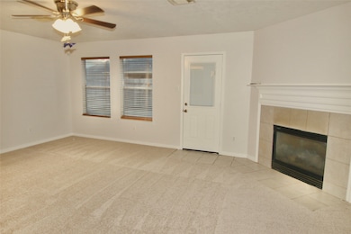 The spacious family room features access to the ba