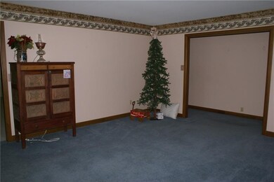 Another view of living room/entryway that leads to hallway