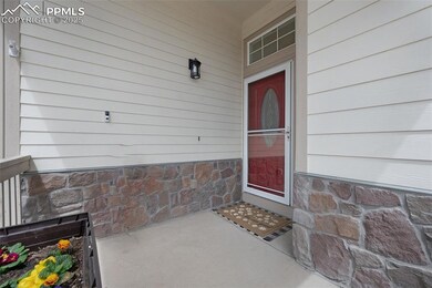 Entrance to property featuring covered porch