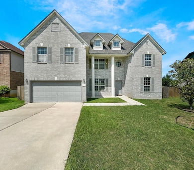 View of front of property featuring concrete driv