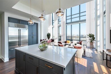 Kitchen featuring stainless steel built in fridge,
