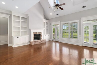 Large great room with gas fireplace, built-in book