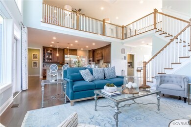 Living room featuring a wealth of natural light, h