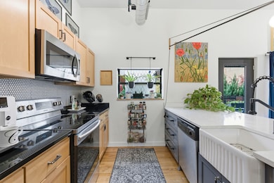 Farmhouse ceramic sink, stainless steel appliances + ample counter space