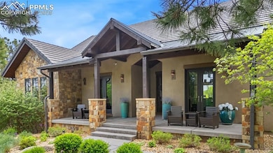 Front Porch featuring stucco, stone, Alder Ceiling and Rafters