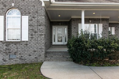 Inviting covered front porch. Perfect for those rocking chairs or porch swing
