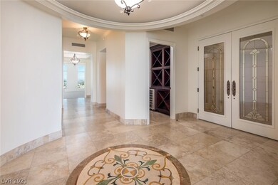 Foyer. Walk in wine room with wine chiller