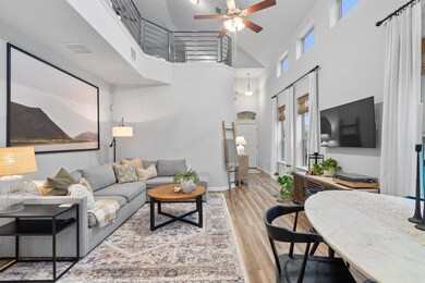 Living area featuring visible vents, baseboards, 