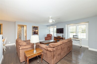 Living room featuring dark hardwood flooring and c