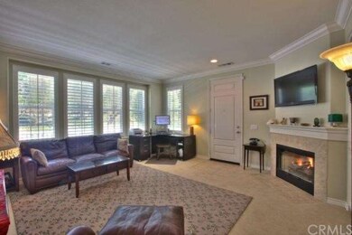 Family room with raised 9' ceilings, lots of windo