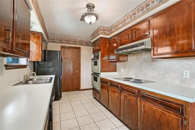 Second view of kitchen. Home includes the refriger