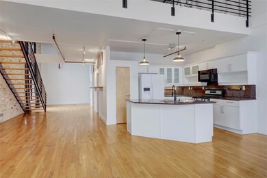 Kitchen featuring white fridge with ice dispenser