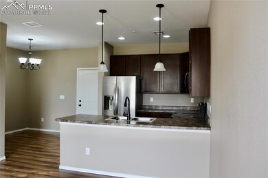 Open kitchen has a nice counter bar with room for 