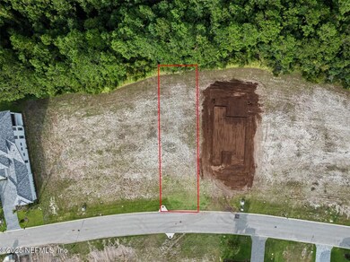 Aerial view with red outline of lot