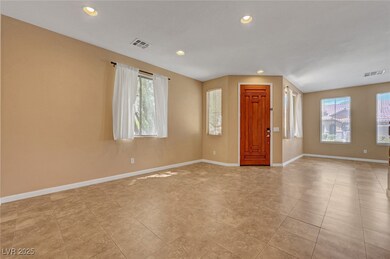 Foyer entrance with recessed lighting, baseboards,