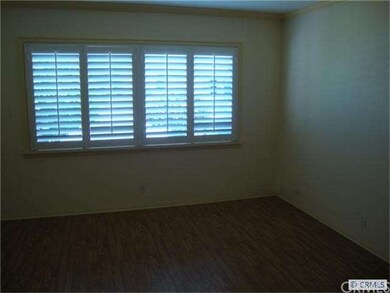 Living room w/ Wood Shutters