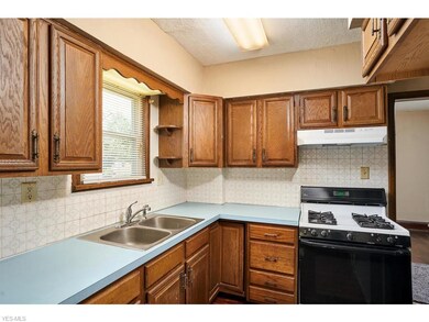 Kitchen with gas range.