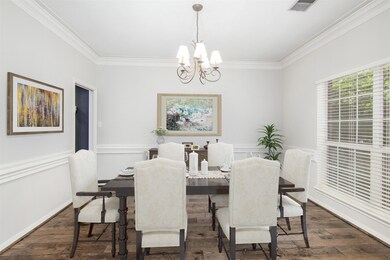 Notice the crown and chair molding and the beautifully updated flooring.