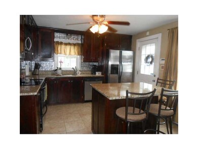 Kitchen. Granite counters and breakfast bar island