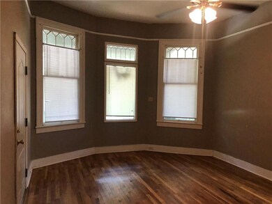 Spare room with dark wood finished floors, ceiling
