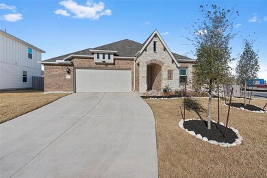 View of front facade featuring an attached garage
